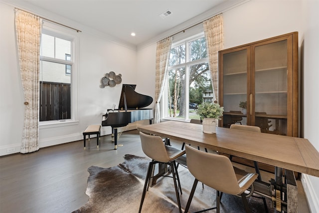 interior space with crown molding and dark wood-type flooring