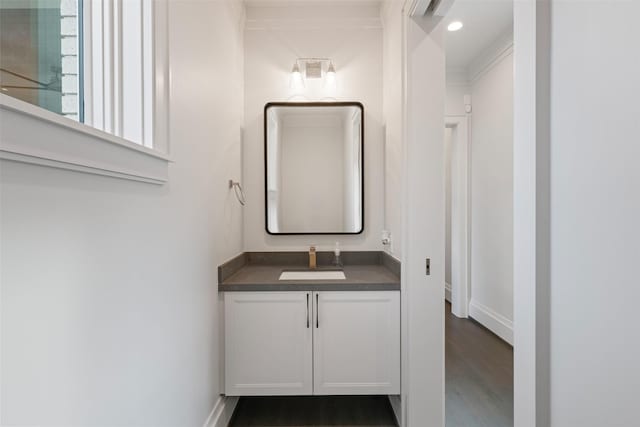 bathroom featuring vanity and hardwood / wood-style floors