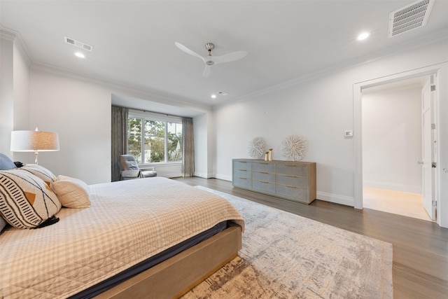 bedroom featuring crown molding, ceiling fan, and hardwood / wood-style floors