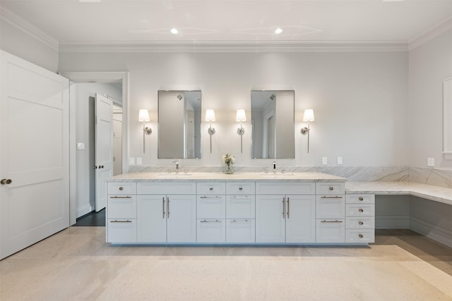 bathroom with ornamental molding and vanity