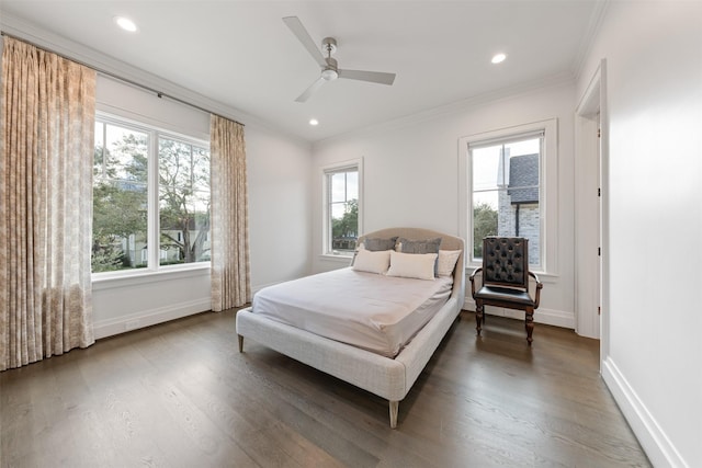 bedroom featuring multiple windows, crown molding, and dark hardwood / wood-style floors