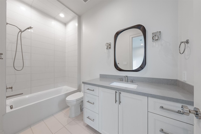 full bathroom with tiled shower / bath combo, vanity, tile patterned floors, and toilet