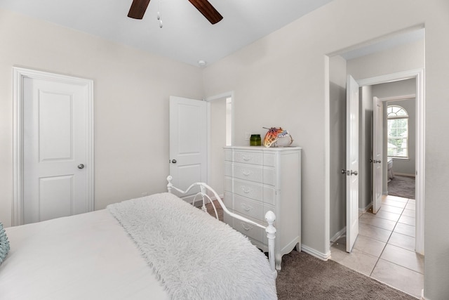 bedroom featuring ceiling fan and light colored carpet