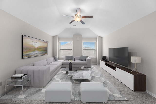 carpeted living room with vaulted ceiling and ceiling fan