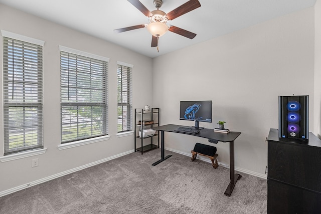 home office with carpet, plenty of natural light, and ceiling fan