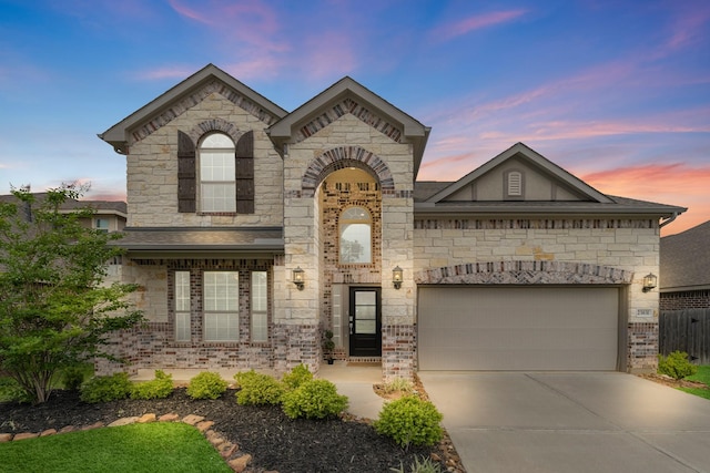 view of front of property with a garage