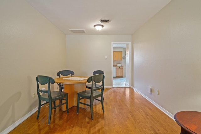 dining space featuring hardwood / wood-style floors