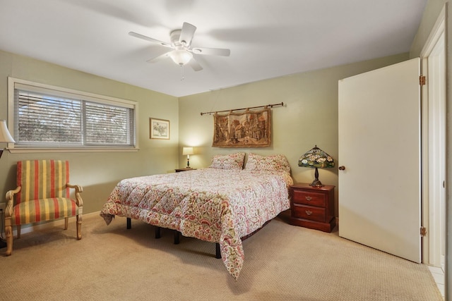 bedroom with ceiling fan and light colored carpet