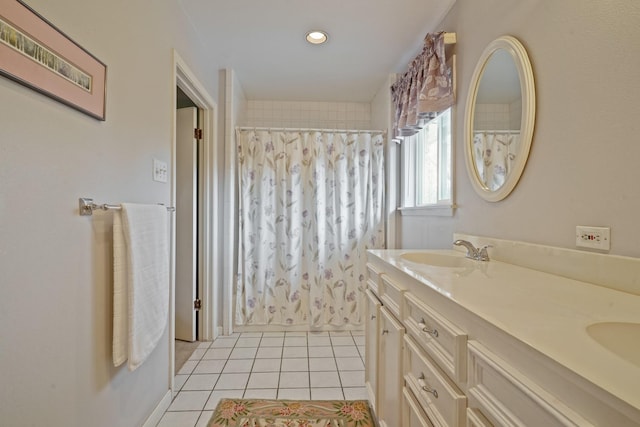 bathroom with tile patterned flooring, vanity, and a shower with curtain