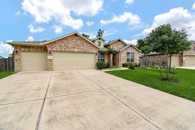 view of front of property with a garage and a front yard