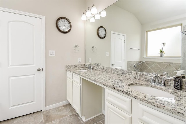 bathroom with vanity and vaulted ceiling