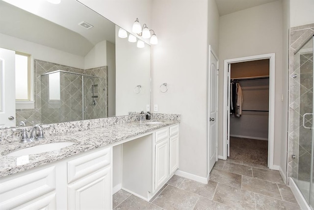 bathroom with vanity and an enclosed shower