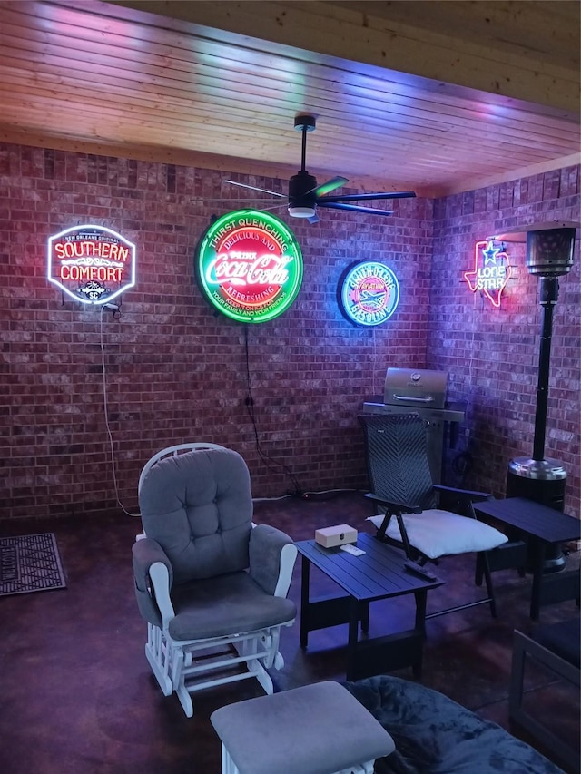 interior space featuring wood ceiling, concrete floors, and brick wall