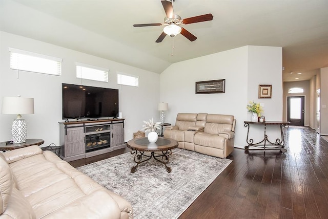 living room featuring ceiling fan, lofted ceiling, and dark hardwood / wood-style flooring