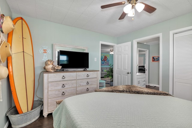 bedroom with dark hardwood / wood-style floors, ceiling fan, and a closet