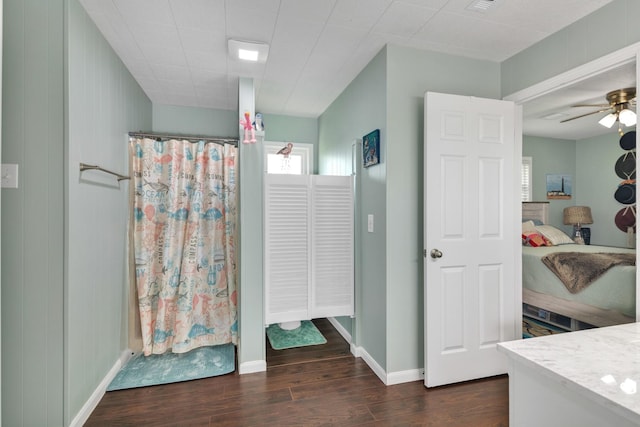 bathroom featuring hardwood / wood-style flooring, vanity, and ceiling fan