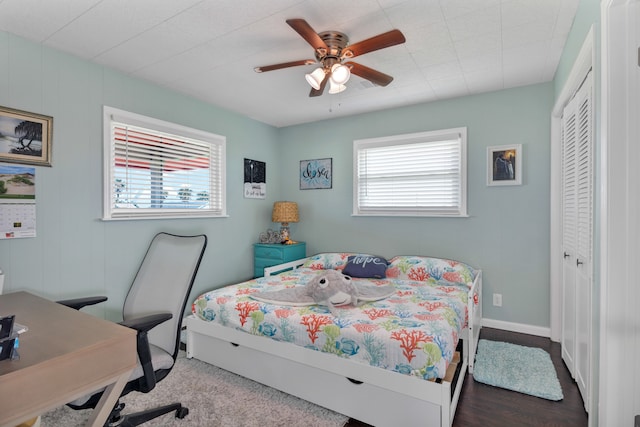 bedroom featuring ceiling fan and a closet