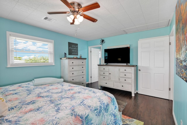 bedroom featuring ceiling fan and dark hardwood / wood-style flooring