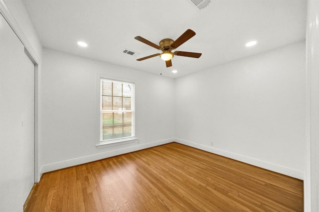 unfurnished bedroom featuring ceiling fan, wood-type flooring, and a closet