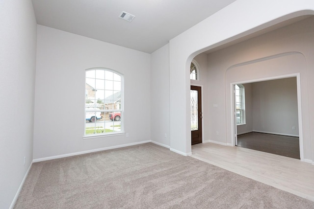 unfurnished room with carpet floors