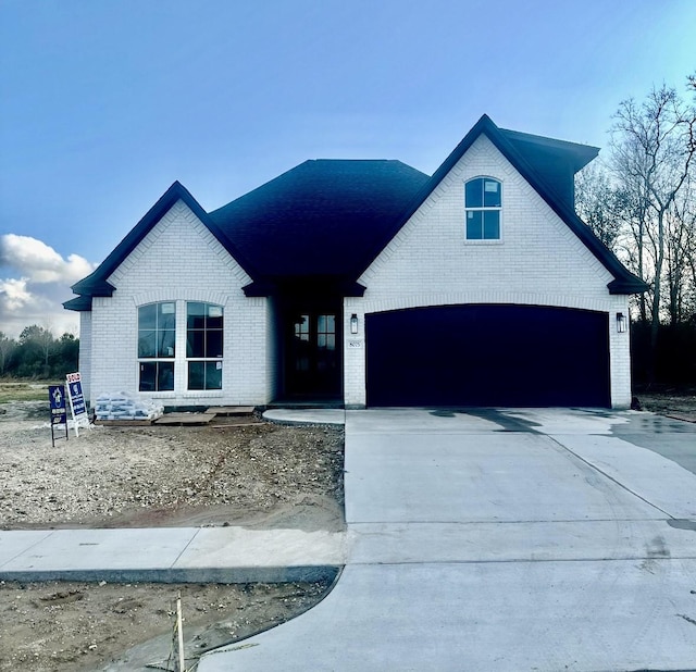 modern inspired farmhouse with a garage