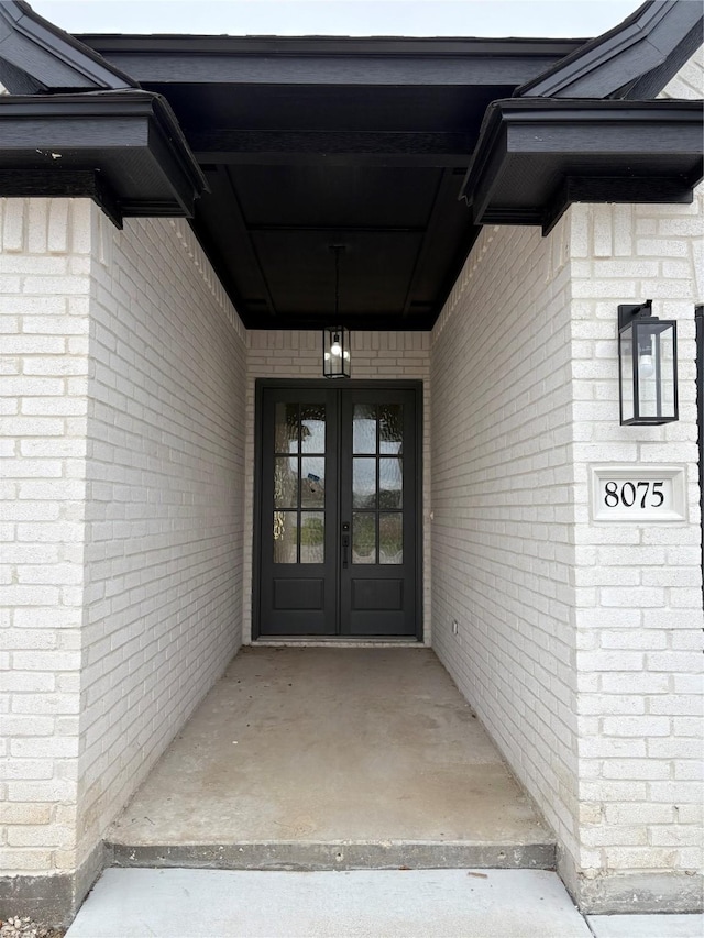 property entrance featuring french doors