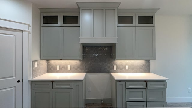 kitchen featuring decorative backsplash and gray cabinets