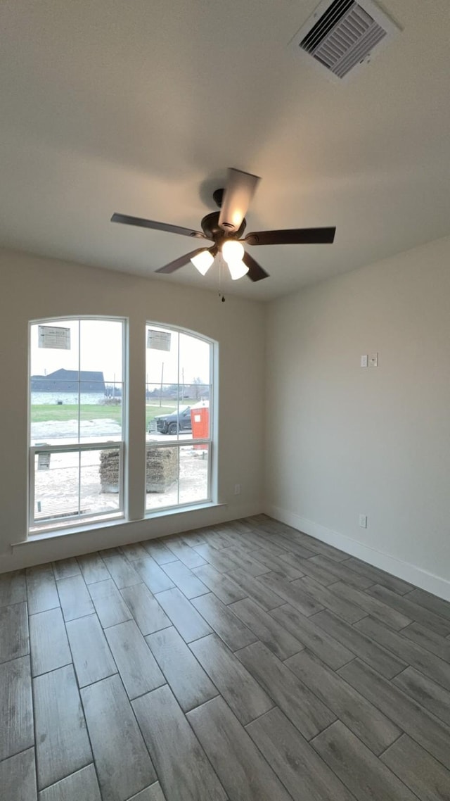 unfurnished room featuring ceiling fan