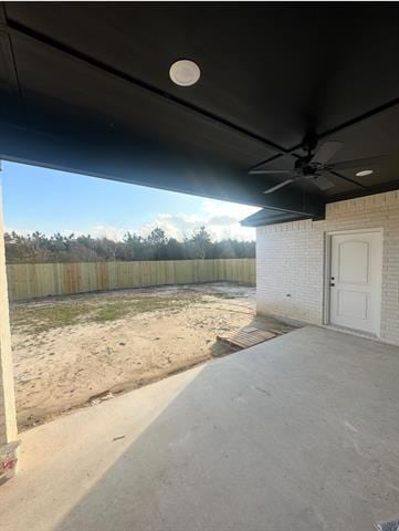 view of yard with a patio and ceiling fan