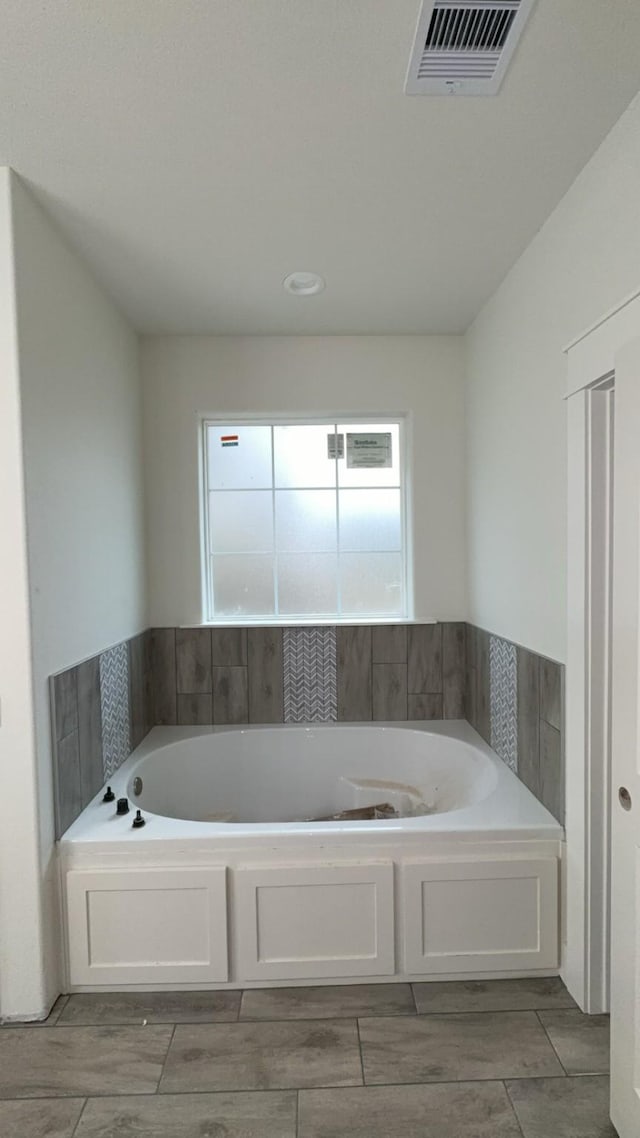 bathroom featuring a tub