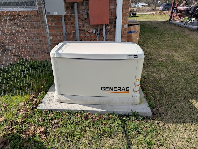 exterior details featuring a power unit and brick siding