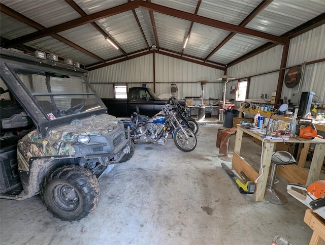 garage featuring metal wall and a workshop area