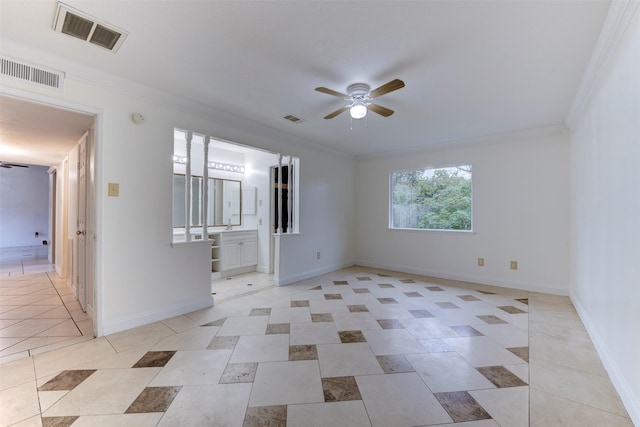 unfurnished room featuring crown molding, light tile patterned floors, and ceiling fan