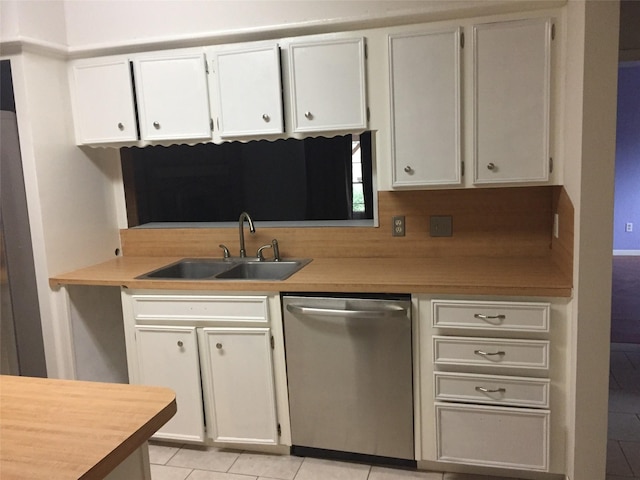 kitchen featuring decorative backsplash, dishwasher, light countertops, a sink, and light tile patterned flooring