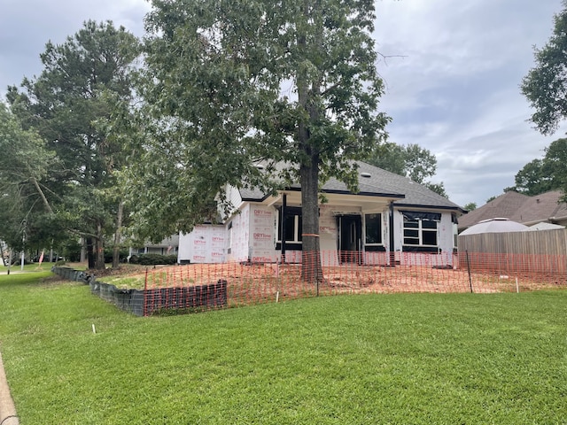 3606 Ohenry Dr, Montgomery, TX 77356 - rear view of property with roof with shingles