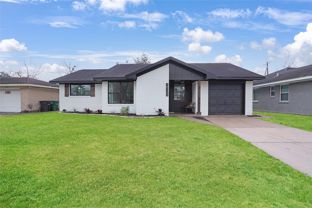 ranch-style house with a garage and a front lawn