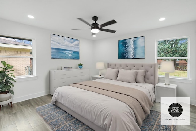 bedroom with hardwood / wood-style floors and ceiling fan