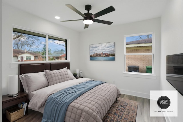 bedroom featuring wood-type flooring and ceiling fan