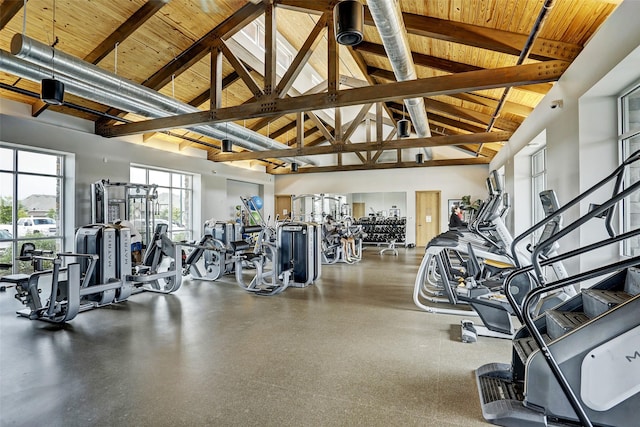 gym featuring wooden ceiling and high vaulted ceiling