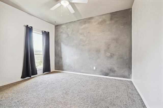 unfurnished room with ceiling fan, carpet flooring, and baseboards