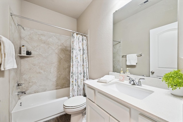 full bath featuring visible vents, a textured wall, toilet, shower / bath combo, and vanity