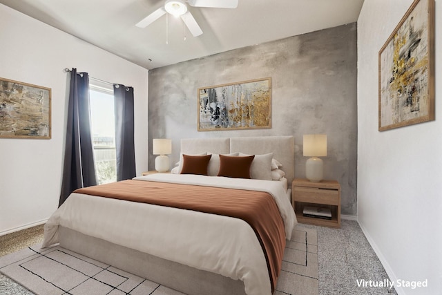 carpeted bedroom with a ceiling fan and baseboards