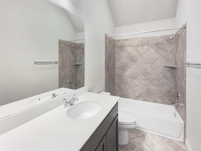 full bathroom featuring lofted ceiling, tile patterned flooring, tiled shower / bath combo, vanity, and toilet