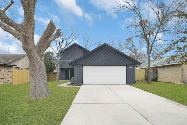 view of front of home featuring a garage and a front lawn