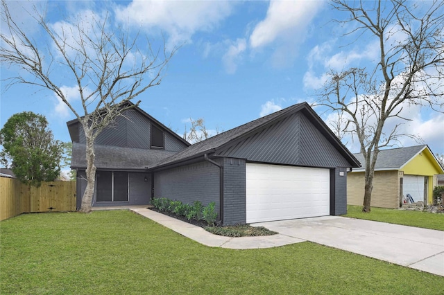 view of front of house with a garage and a front yard