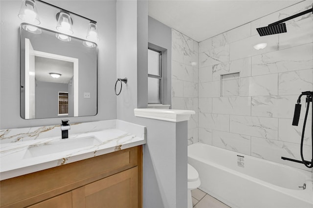 full bathroom with vanity, tiled shower / bath combo, and toilet