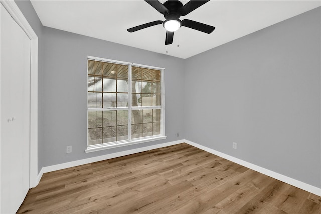 unfurnished room featuring light hardwood / wood-style floors and ceiling fan