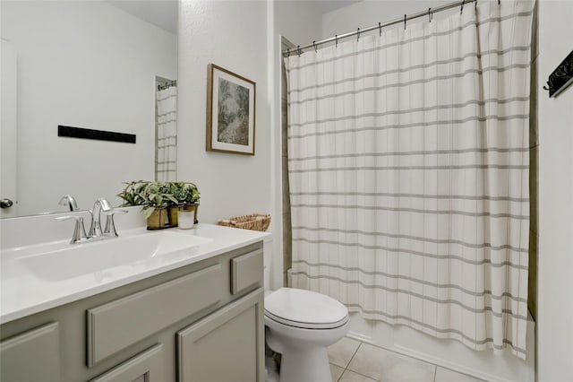 full bathroom with shower / bath combo, vanity, tile patterned floors, and toilet