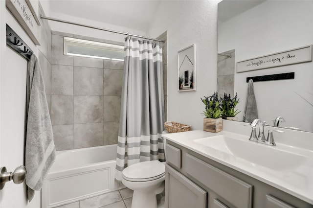 full bathroom featuring vanity, tile patterned floors, shower / bath combination with curtain, and toilet