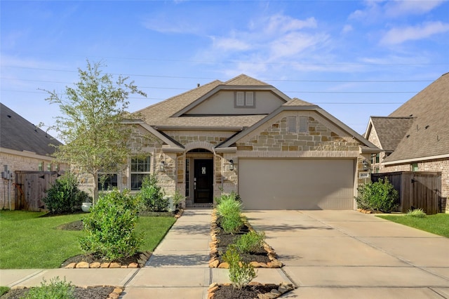 view of front facade with a garage and a front lawn